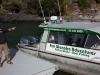 De schipper en zijn boot voor onze Eco Wanaka Adventure